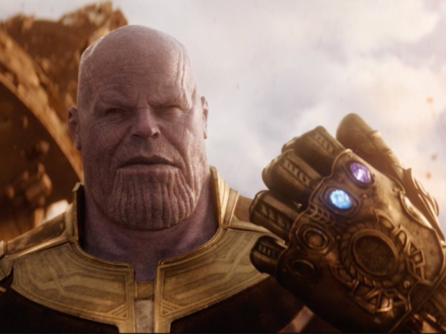 Thanos holding up the Infinity Gauntlet