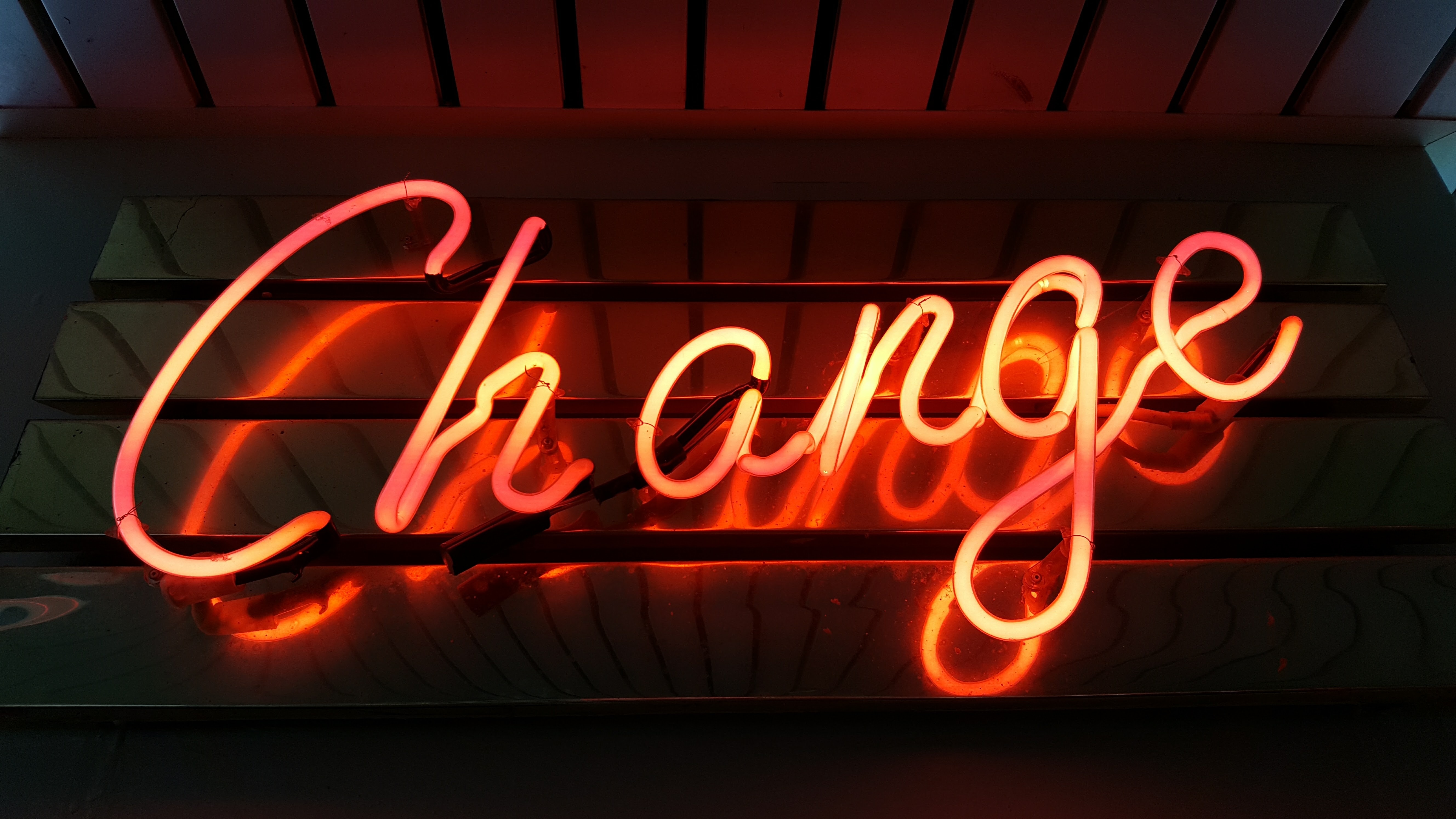 Neon sign reading &ldquo;Change&rdquo;
